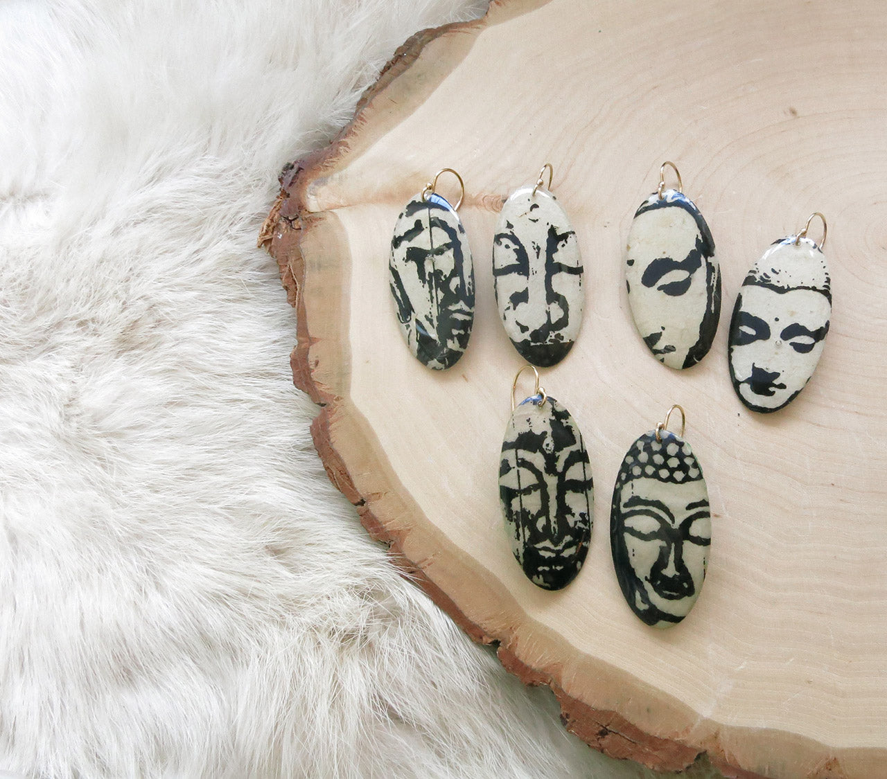 Buddha Faces Shield Dangles